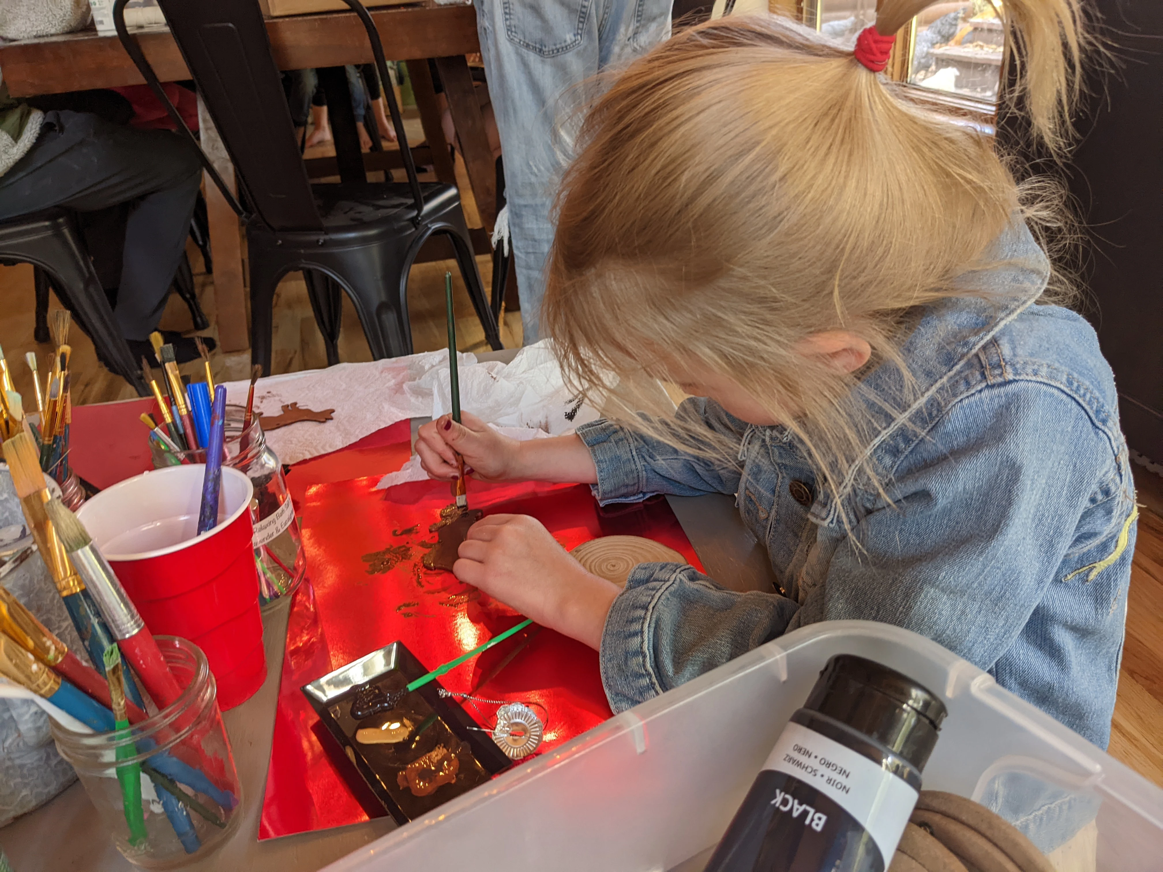 Emmy painting at an art table
