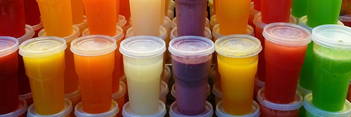 Rainbow of fresh fruit smoothies in clear cups. La Boqueria market, Barcelona. Photo: Cary Bass-Deschenes, CC BY-SA 2.0
